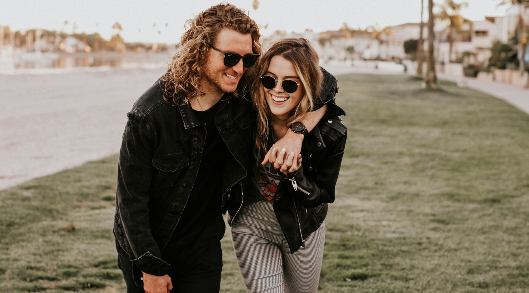 a couple walking over a lawn
