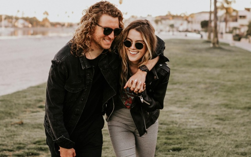 a couple smiling and walking
