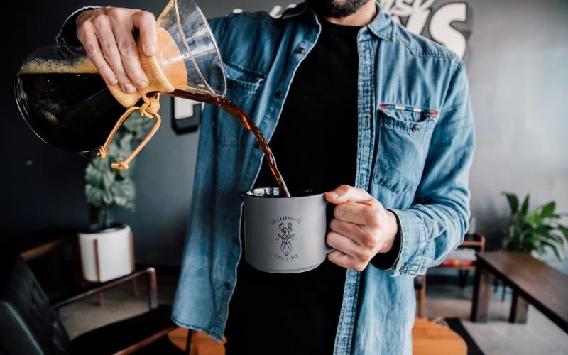 a man holding a coffee cup