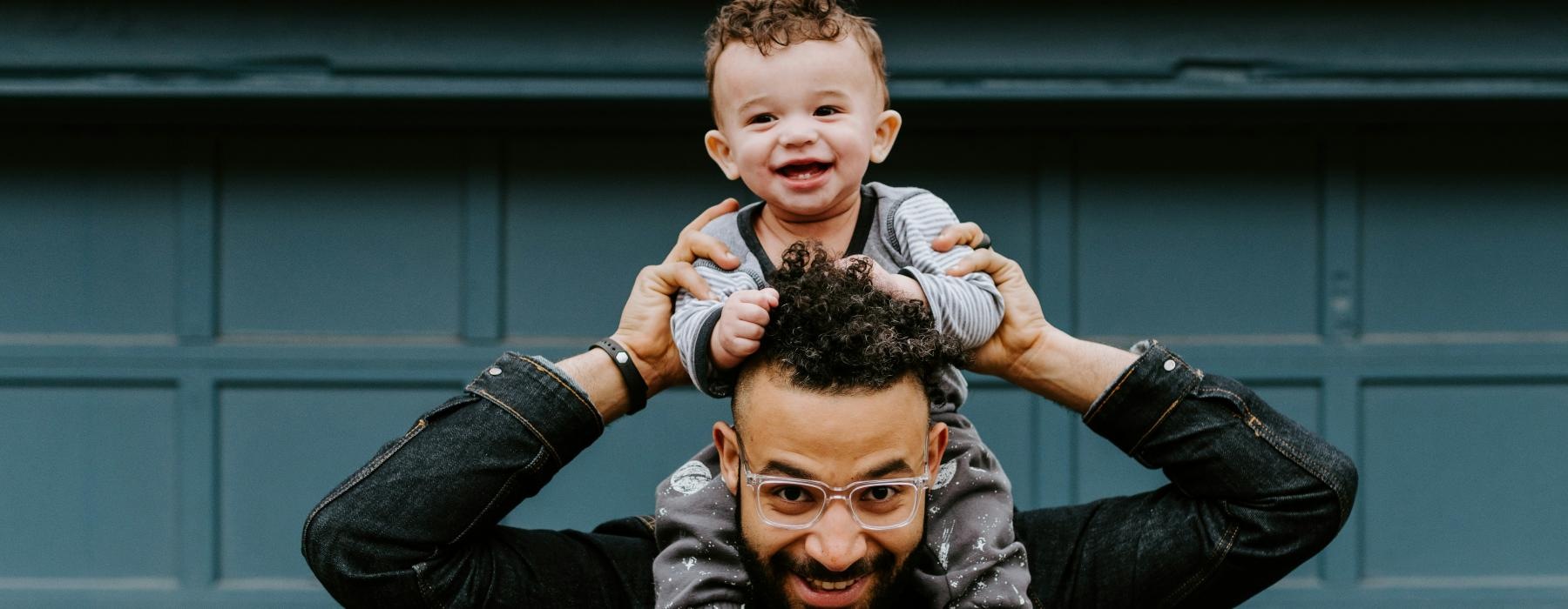 a man holding a child