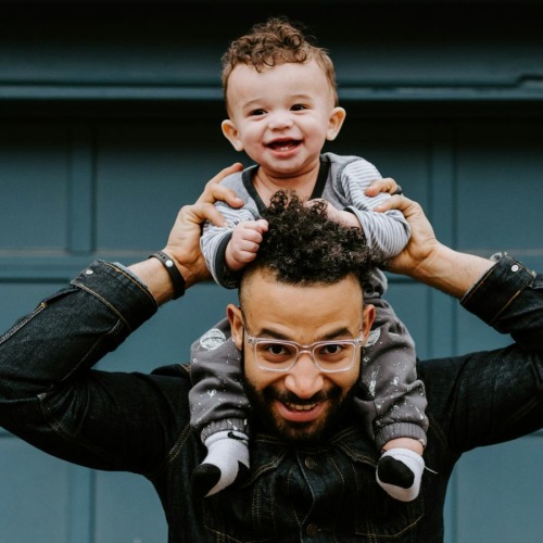 a man holding a child